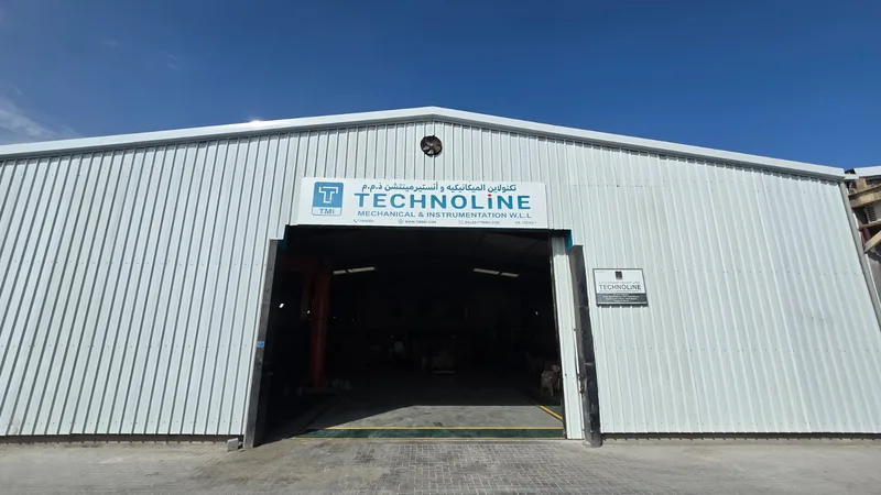 Entrance to the TMI workshop with the Technoline sign above the doors