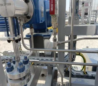 Close-up of modified instrument tubing at a flanged instrument connection